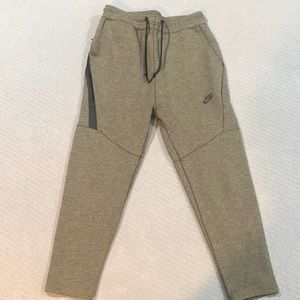 Men’s Nike Joggers with drawstring and large zipper pocket on right side.